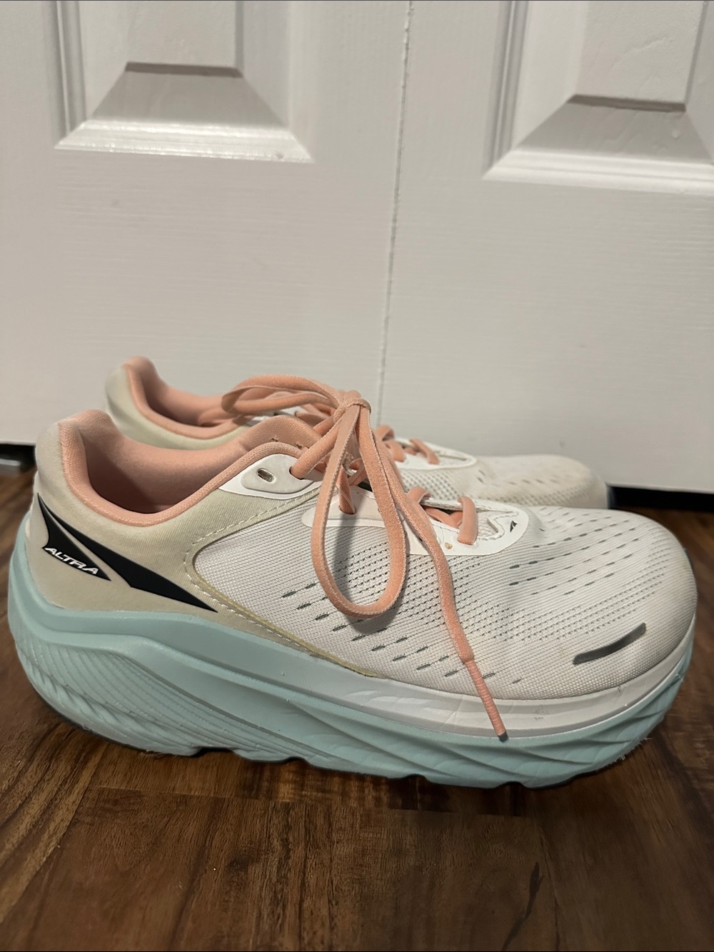 Altra Women's White Running Shoes with Peach Accents and Light Blue Midsole